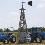 Walt's Tractor - LS Tractors in front of a windmill