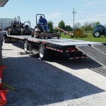 Walt loading the zero turn mower onto a trailer